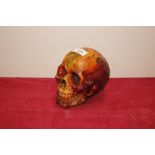 An amber coloured skull