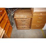 An oak three drawer bedside chest