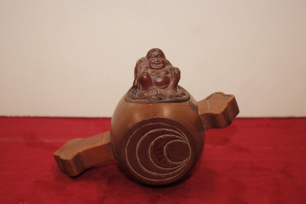 A wooden box of barrel shape, the lid decorated wi