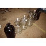 Six various glass demi-johns