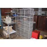 A galvanised wirework vintage school shoe rack