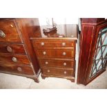 A mahogany hi-fi cabinet with lifting top and mock