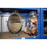 A small brass mirror on stand; and a clown doll wit