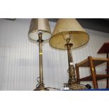 A brass corinthian column table lamp and shade and