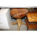 A root carved rustic side table