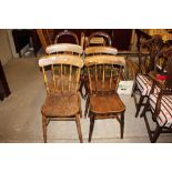 A set of four late 19th Century elm seated spindle