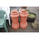 Two pairs of plastic garden planters in the shape