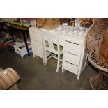 A white painted pedestal desk and chair