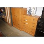 A modern pine effect, five drawer chest and matchi