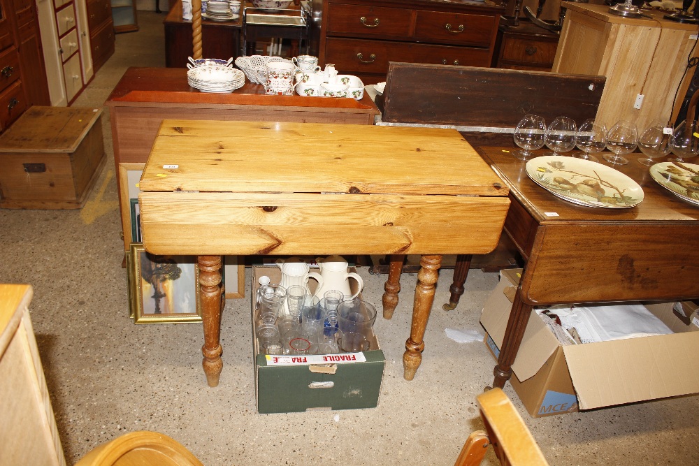 A modern stripped pine kitchen table