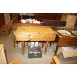 A modern stripped pine kitchen table