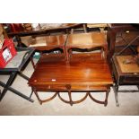 A mahogany oblong coffee table fitted drawers; and