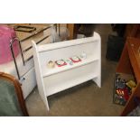 A white painted set of open fronted bookshelves