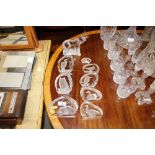 Various decorative glass paperweights; and a glass elep