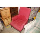 An early 20th Century red upholstered armchair