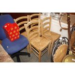 A set of four pine and rushed seated kitchen chair