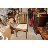 A pair of oak rail back dining chairs