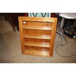 A pine wall display case
