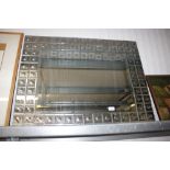 A large bevel edged wall mirror