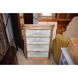 A stripped pine corner cabinet