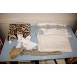 A quantity of assorted linen, table cloths, curtai