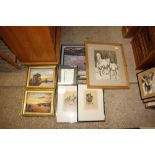 A collection of various paintings and prints