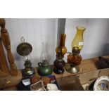 Four various oil lamps