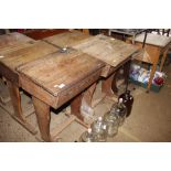 A pair of vintage pine school desks