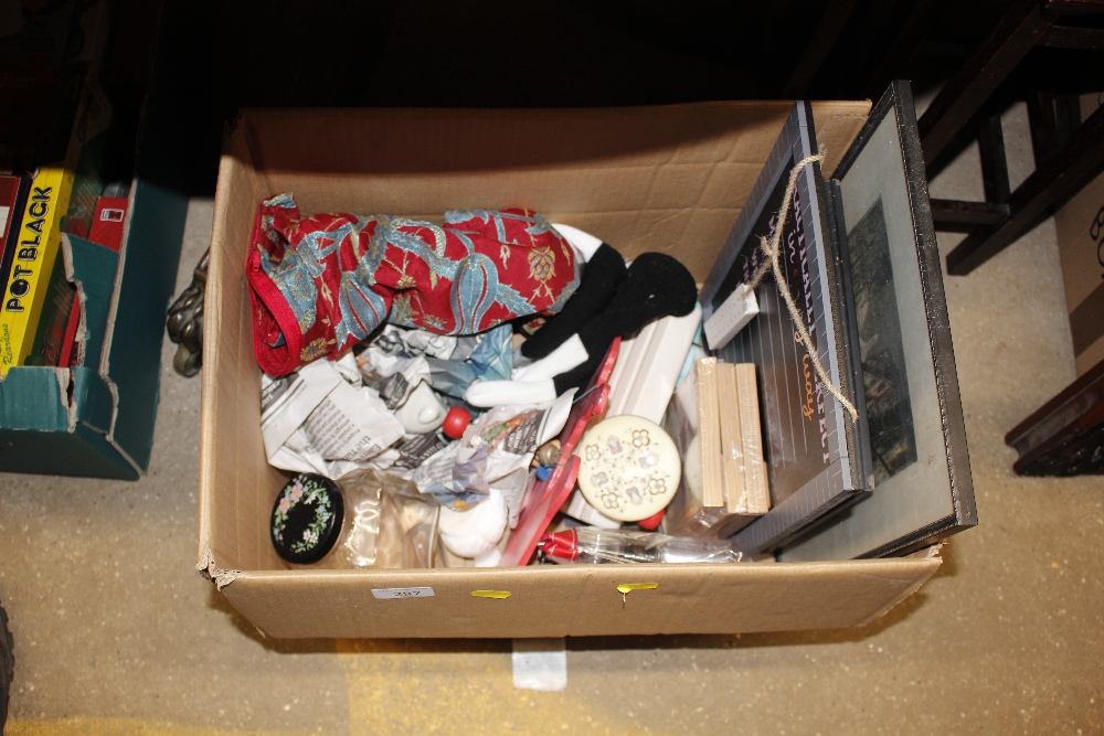 A box of miscellaneous items including various prints etc.