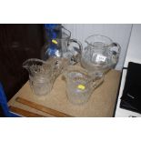 Four vintage glass jugs