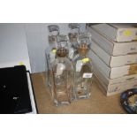 Four glass decanters