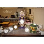 Various decorative mantel and alarm clocks