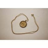 A 1913 half Sovereign in gold mount, and hung to a