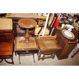 A circular oak occasional table; a standard lamp;