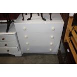 A modern Melamine four drawer chest