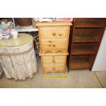 A pair of stripped pine two drawer bedside chests