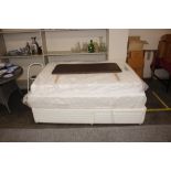 A 5ft divan bed with drawers to the two section
