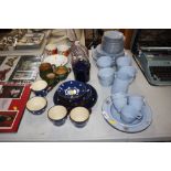 A quantity of blue and gilt vintage teaware; polka