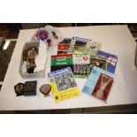 A quantity of bird prize rosettes, football programmes e