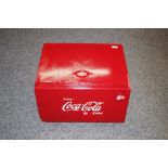 A reproduction Coca-Cola cool box