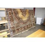 A large floral and brown patterned rug, approx. 11