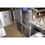 Two stainless steel kitchen storage cabinets