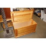 A stripped pine blanket box