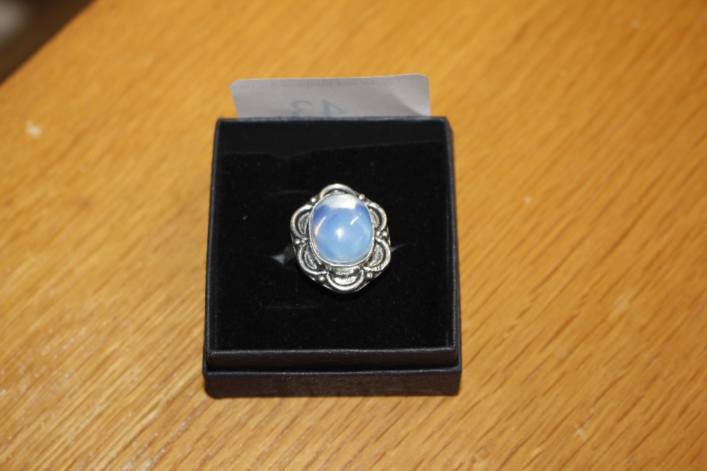 An opaline and white metal mounted ring