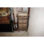 A wicker bombe shaped three drawer bedside chest