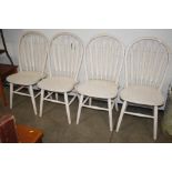 A set of four painted stick back kitchen chairs