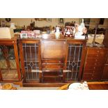 A 1930's oak side-by-side bureau bookcase