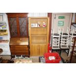 A modern light oak open fronted bookcase with cupb