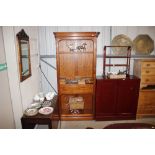 A modern polished wood tall open fronted bookcase