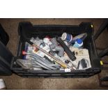 A plastic crate containing various plumbing fittin